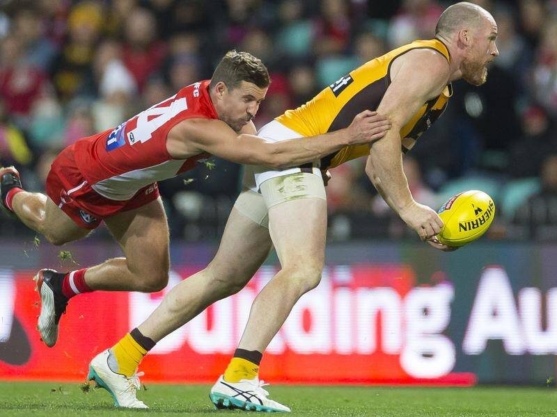 Jarryd Roughead (R) could run on with the Hawks next weekend after his AFL return against Sydney.