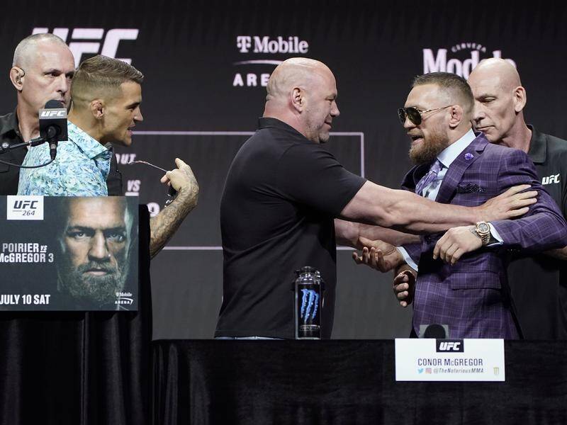 Promoter Dana White keeps Conor McGregor away from opponent Dustin Poirier before their UFC bout.