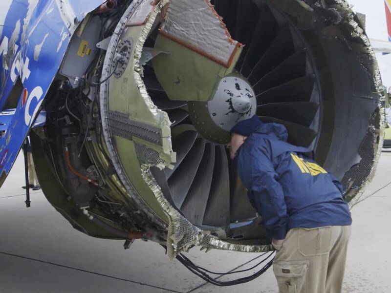 Investigators examine the engine which exploded midair on a Southwest Airlines flight, killing one.