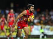 Lachie Weller has signed a new four-year deal with the Gold Coast Suns. (Jono Searle/AAP PHOTOS)