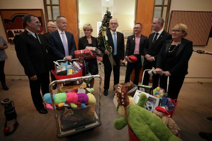 Opposition Leader Bill Shorten, Foreign Affairs Minister Julie Bishop, Prime Minister Malcolm Turnbull and Greens Leader Richard Di Natale with the gifts for the Kmart wishing tree at the Prime Minister's office at Parliament House. Photo: Alex Ellinghausen