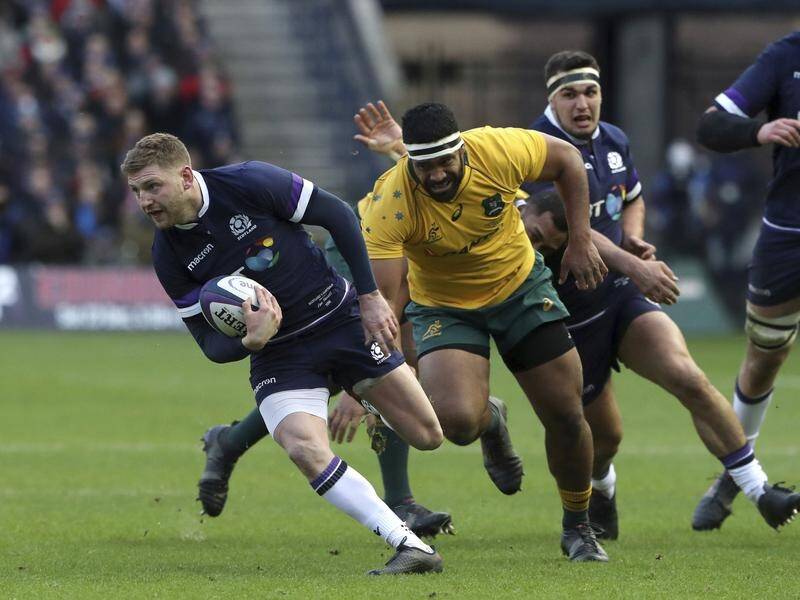 Scotland fly-half Finn Russell (l) has been disciplined for a breach of team protocol.