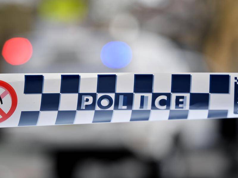 Two police officers were allegedly threatened by a man who produced a knife in a Sydney car park.