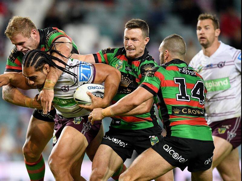 Damien Cook (centre) doesn't want to see fellow hooker Robbie Farah (14) leave the Rabbitohs.