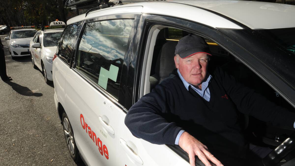 SAFETY FIRST: Taxi drivers like Peter Neville have to look after their own safety before taking fares in risky areas of Orange. Photo: STEVE GOSCH                                                                                                                                          0624sgtaxi1