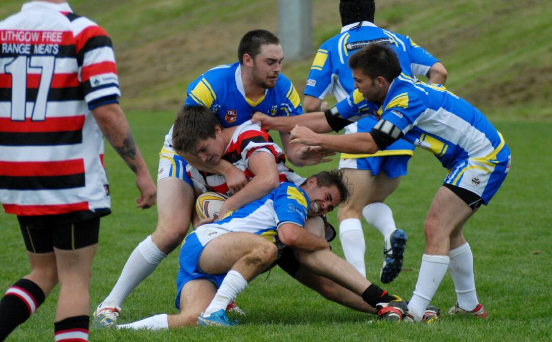 UNDERWAY IN 2014: CSU Blue and Lithgow Bears rip into their round-one Centennial Coal Cup clash on Sunday. Photo: ZENIO LAPKA