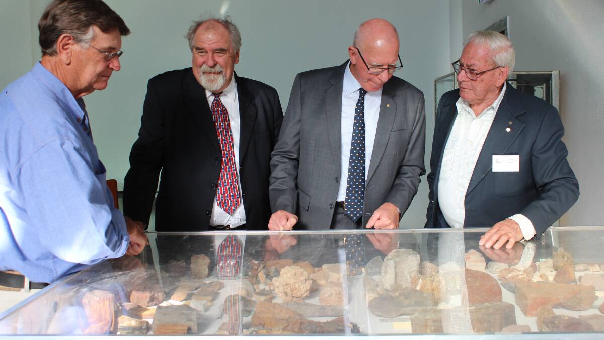 ABOVE: 
Bernie George, Dr Buzz Sanderson, and Bob 
Tomlinson discuss one of the new exhibits at the Kandos Museum with Governor David Hurley (second from right) 
041014\ls kandos 100\