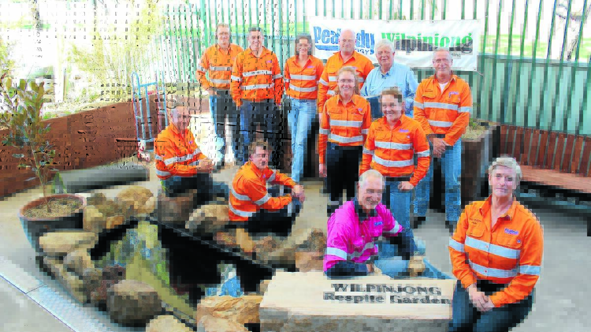 Staff from Wilpinjong helped completed the respite garden at Lifeskills Plus on Friday.