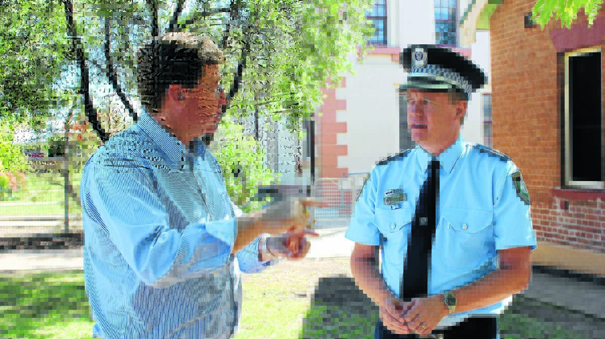 Police minister Troy Grant speaking with Mudgee LAC superintendent Anthony Joyce earlier this year.