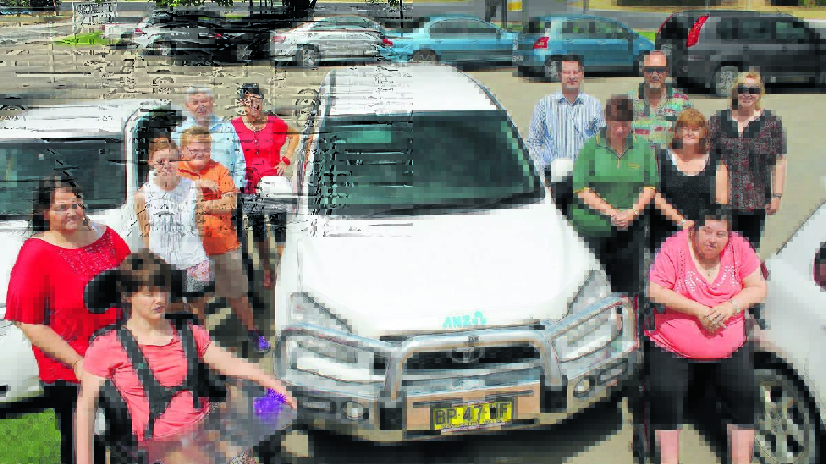 Lifeskills Plus will add Driver Knowledge Test training to their program in 2015, with the help of a grant from ANZ. Pictured are local ANZ branch manager Malcolm Woods and regional Executive Timothy Cranfield together with Lifeskills Plus clients, CEO Carolyn Peek and Lifeskills Plus staff members on Tuesday.