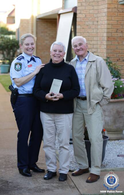 HOME: Orana Mid-Western Police Districts Inspector Natalie Antaw handed over the World War II diary to Rosie Gibson and her husband Don on Thursday. Photo: NSW POLICE