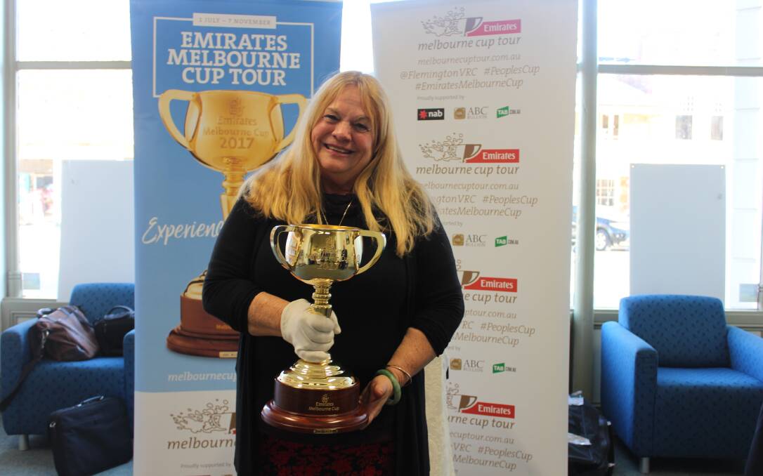 PIECE OF HISTORY: Wendy Green, the owner of 1999 Melbourne Cup winner Rogan Josh, appeared in Mudgee on Tuesday with the 2017 trophy. Photo: Isaac McIntyre