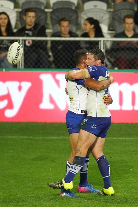Josh Jackson celebrates with his teammate as the Bulldogs score another try in Dunedin.