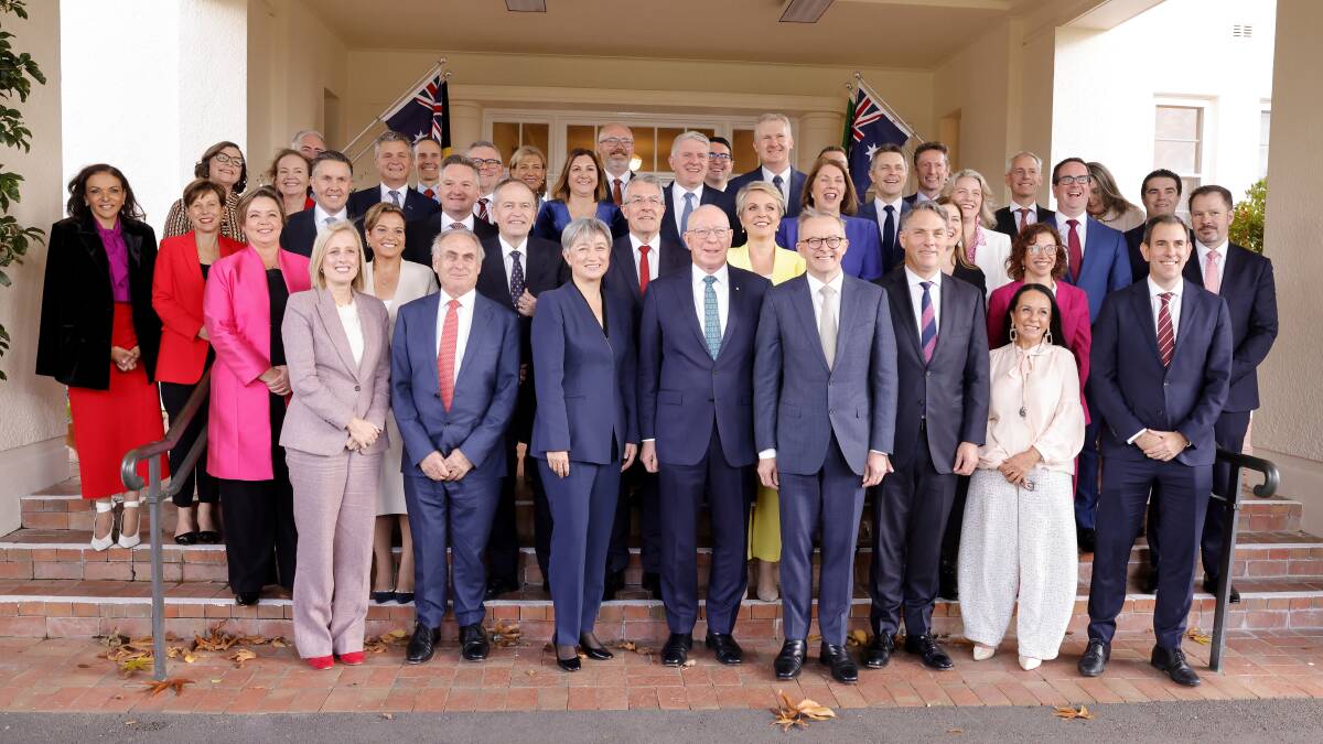 Prime Minister Anthony Albanese poses with his new ministry after their swearing-in ceremony at Government House on Wednesday. Picture: Getty Images