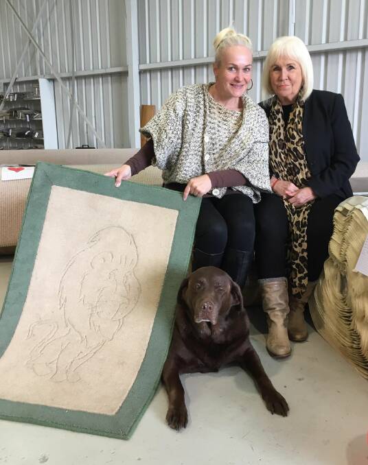 Melissa Quinn (left) and Barbara Quinn (right) with Prada who has held a part-time position at Kruger Carpets for quite some time. Photo: Jay-Anna Mobbs