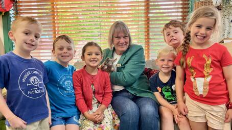 Rosie with Mudgee Preschool students and beloved animal companion, Polly Possum. Photo: Benjamin Palmer