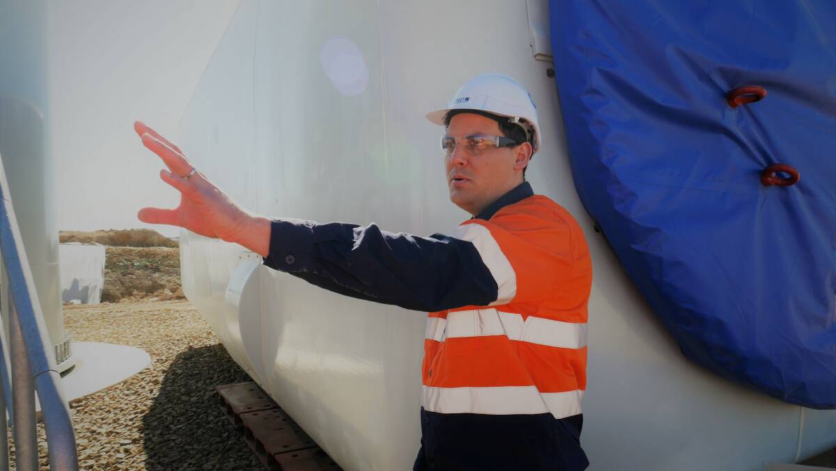 WORK: Site Manager and wind turbine assembly. Photo: CWP Renewables