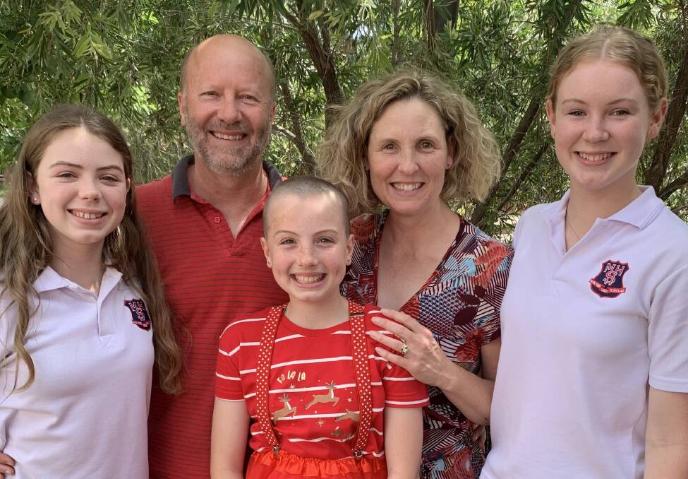 Piper with her family post-shave. Photo: Supplied