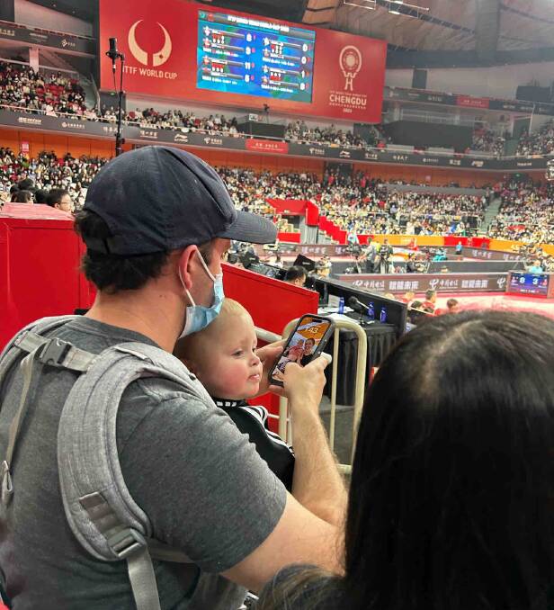 Michelle's partner Stuart and son Lachie supporting Michelle on the sidelines in China. Supplied