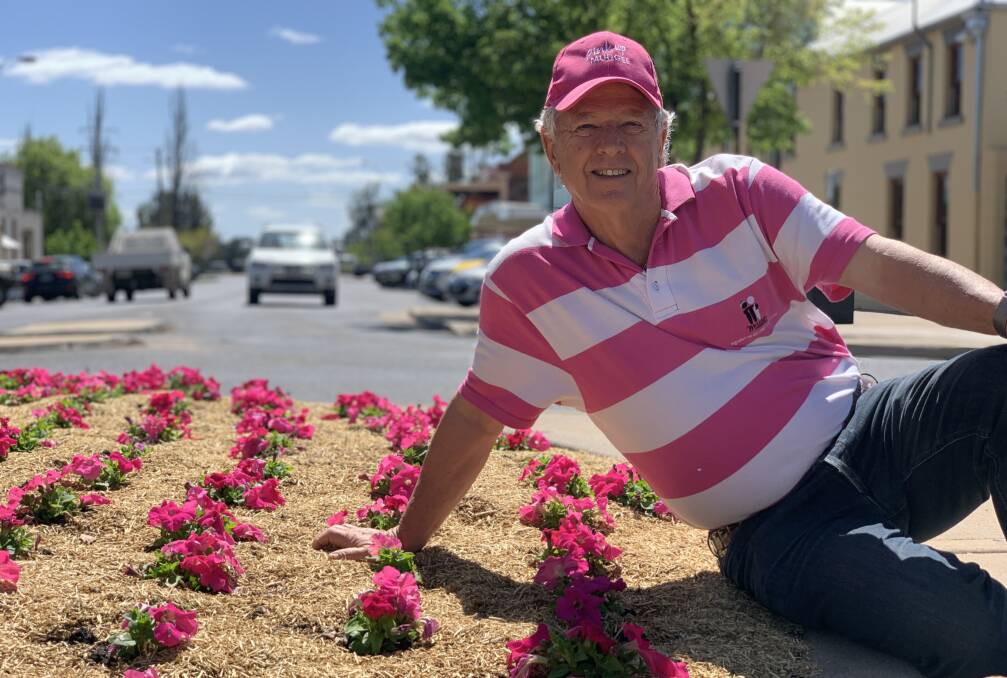 Hugh among pink flowers planted as part of Pink Up Mudgee 2020.