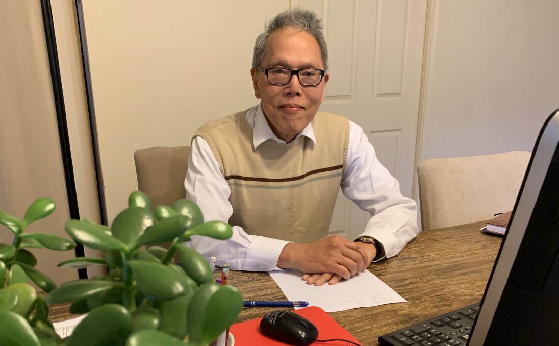 Enrique Reyes sitting at the same desk he used for most of his tutoring career. A 'home office' that has seen hundreds of students pass through.Photo: Benjamin Palmer