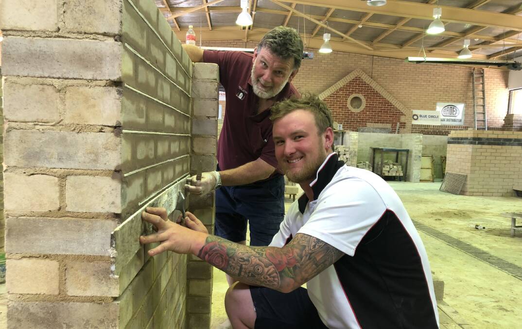 MATES: TAFE NSW Bricklaying student Josh Mumberson is with TAFE NSW Teacher Peter Moore.