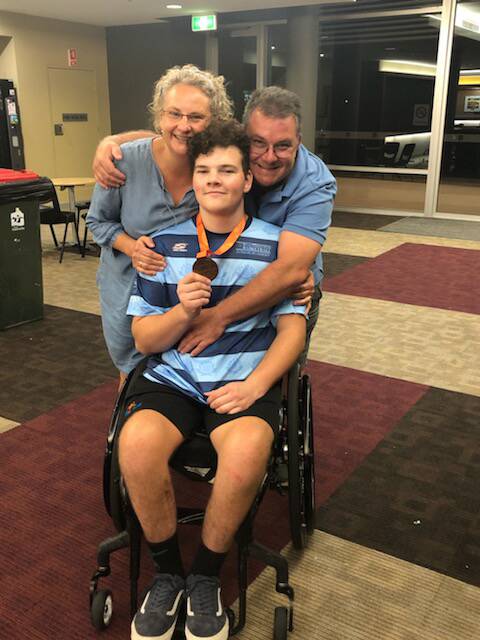 Jarrod with his Brendan Talbott Encouragement Award along with the silver medal. Photo: Blues Wheelchair Basketball Club