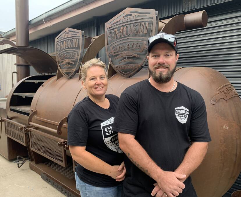 CHUFFED: Brody and Laticia Crawford in front of the newly-placed mega smoker on Wednesday.