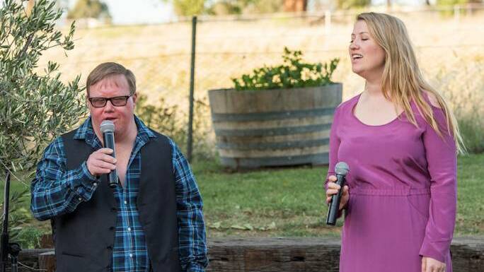 Joseph and his sister Lara belt out some favourites during Joseph's 40th birthday celebrations. Photo: SUPPLIED