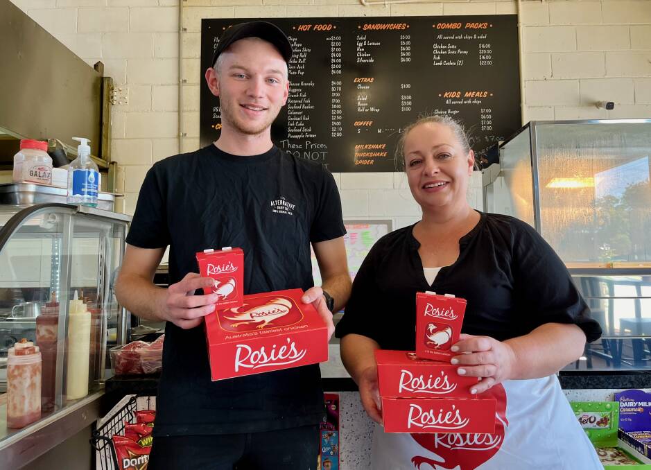 Zach Haywood and Sarah Gray at Daily Dose on Market Street posing with Rosie's boxes ahead of the opening. Photo: Benjamin Palmer