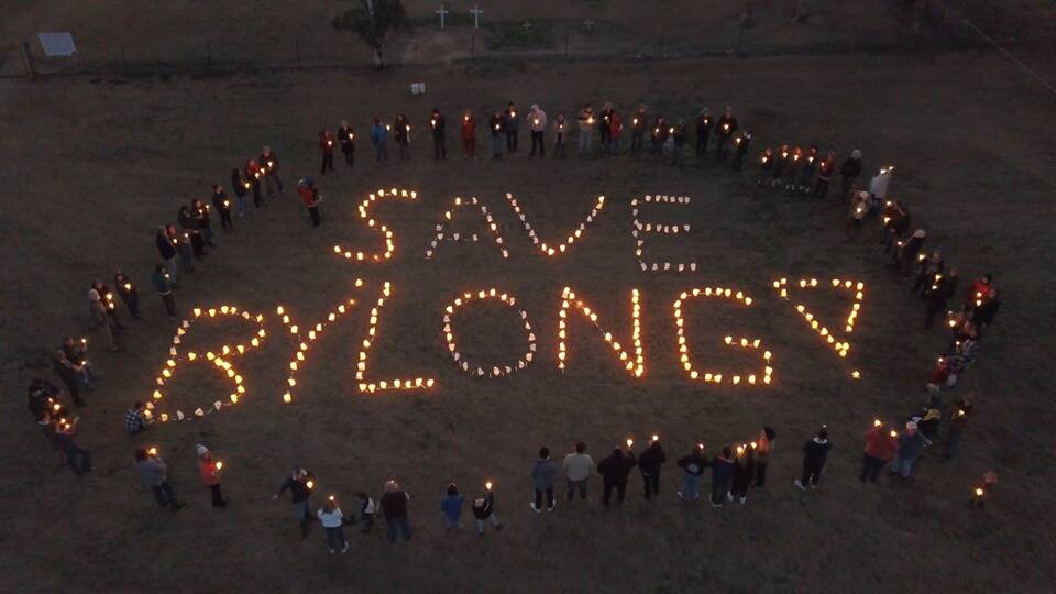 People at a country music show at Bylong stage a light show in support of the valley in 2019.