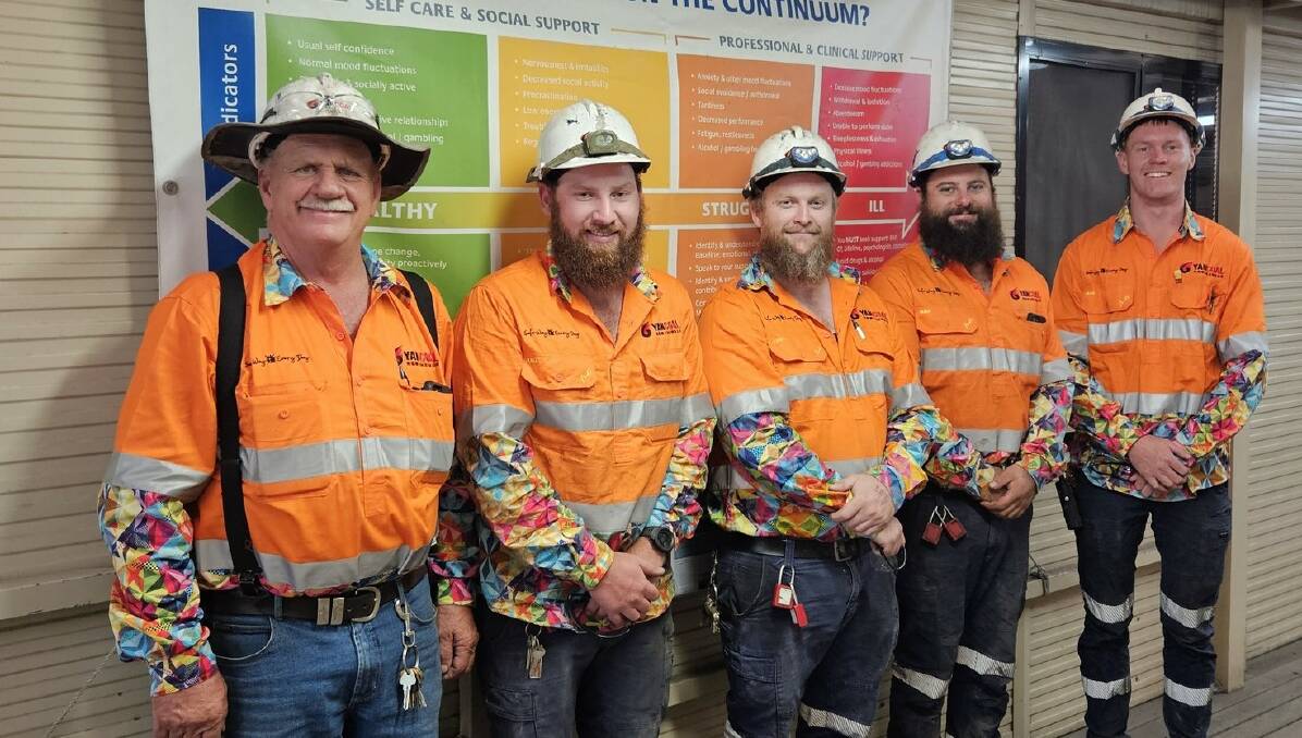 Moolarben Coal employees proudly wearing their bright and colourful shirts in support of mental health. (From left to right: Mick Lewis, Mitchell Blewitt, Reece Gardner, Jake Vella and Bailey McCabe). Photo: Supplied