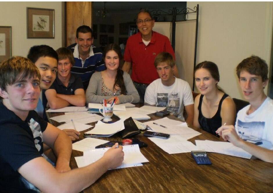 Enrique and some of his past students at the big table often shared by students. Photo: Supplied