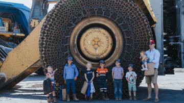 Ben Phillips from Moolarben Coal and his family enjoying getting up close to the equipment. Supplied