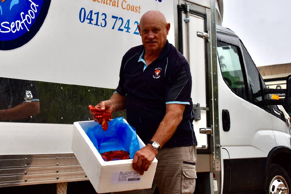 CATCH: Kent Baldwin with some fresh prawns out the front of his truck stationed at the Mudgee St John's Anglican Church. Picture: JAY-ANNA MOBBS