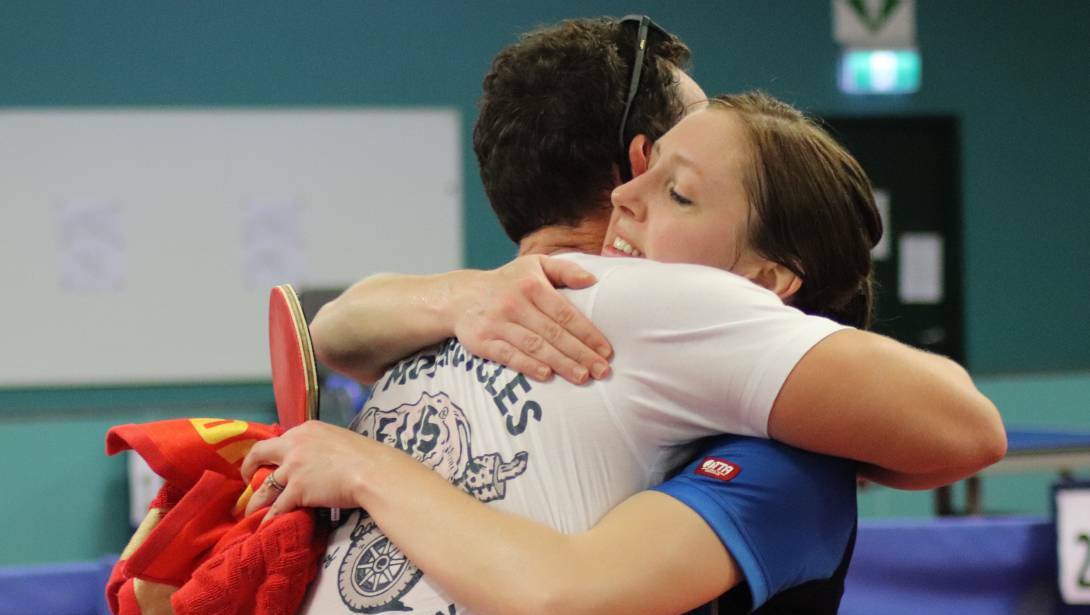 FAMILY: Michelle huge her brother John after qualifying for the Olympics. Photo: Table Tennis Australia