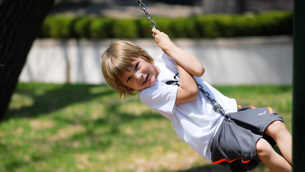 We didn't want to influence the vote, so here's a cute photo of a kid on a swing.