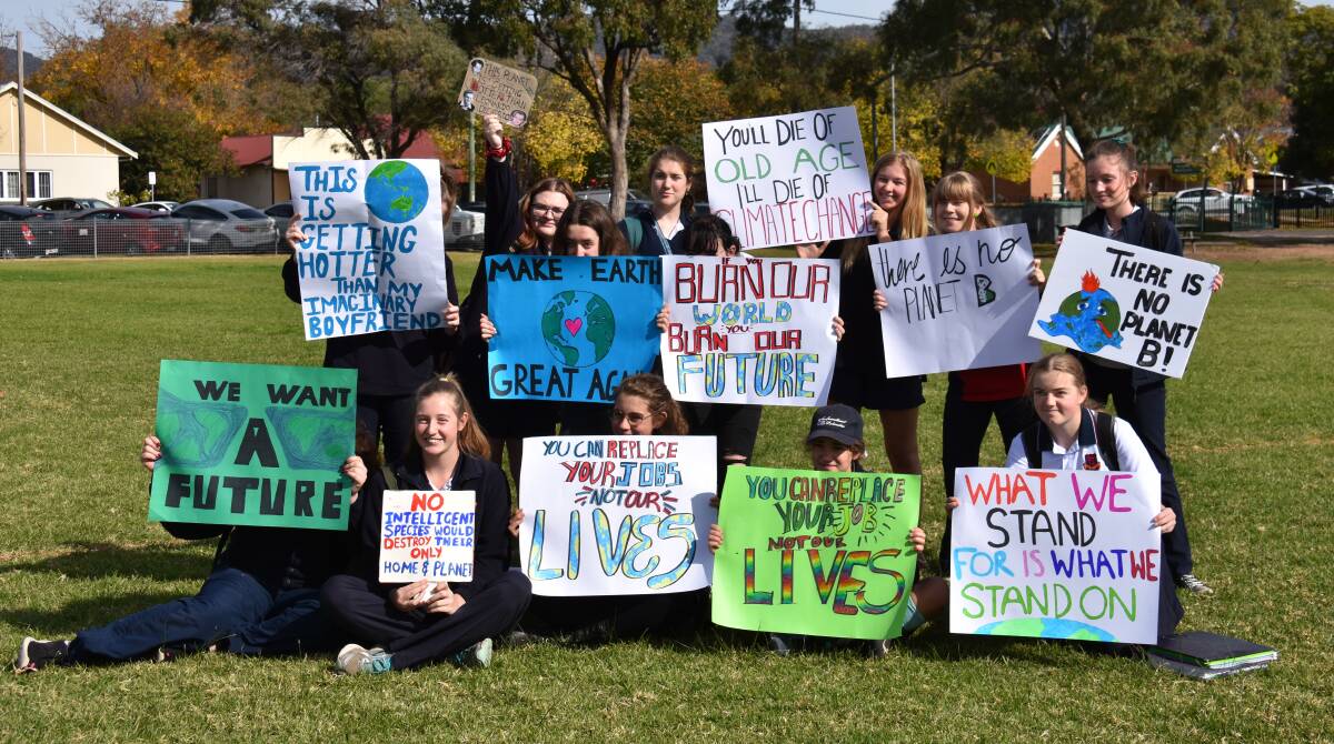 The Mudgee High School students before marching the streets of Mudgee holding signs calling for drastic action on climate change. Photo: Jay-Anna Mobbs