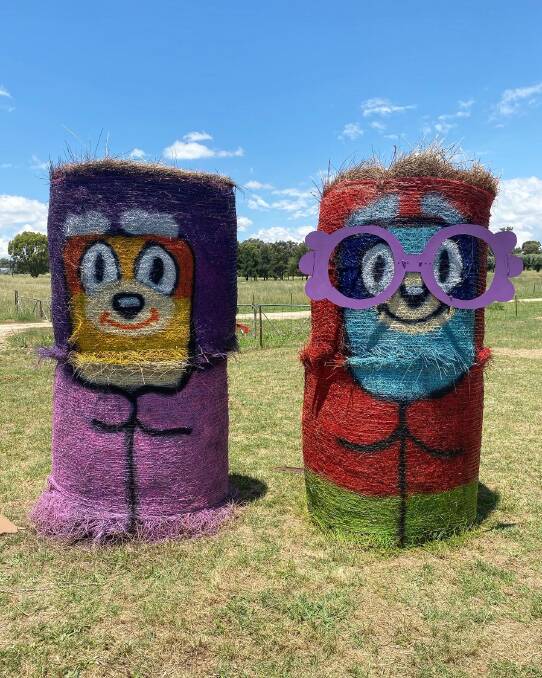 Here come the grannies: Bluey characters Rita and Janet as hay bales along Wollar Road. Photo: Submitted / Keira Underwood