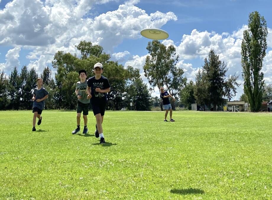 GET ACTIVE: Ari Howes, Max Wolfson, Jake Wolfson and James Manners playing a session of ultimate frisbee. Photo: Supplied