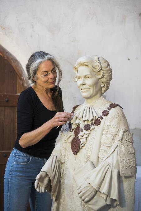 FINISHING TOUCHES: Sculptor Margot Stephens works on the Joy Cummings statue in her Mudgee studio in 2019. Photo: Amber Hooper