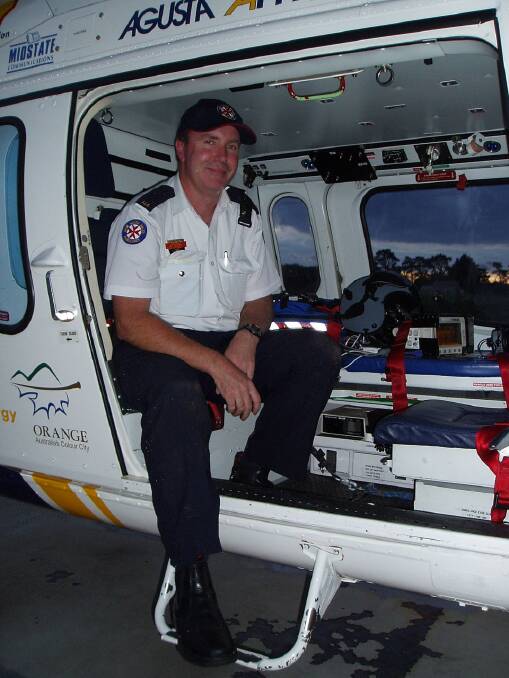 PARAMEDIC: David on a Careflight helicopter when he flew to Orange Base Hospital from an accident scene near Cooyal. Photo: Supplied/David Mangan