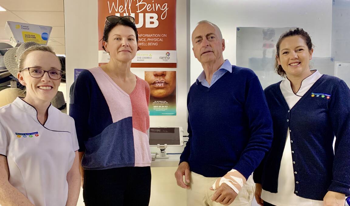 READY TO HELP: Cass Mastrone with Peter Druitt, flanked by Bloom's owners Sally Harris (left) and Alex Keipert (right).