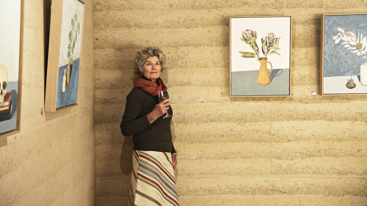 Kay Norton-Knight in the gallery in 2021 which features rammed-earth walls. Supplied