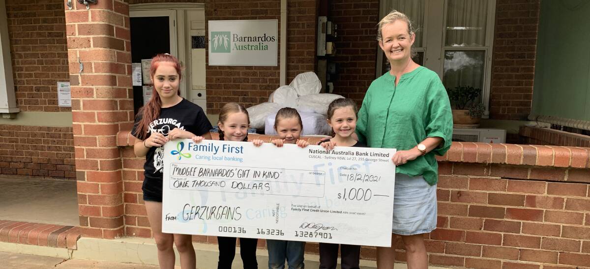 Barnardos Mudgee program manager Kate Cormie accepiting the cheque.