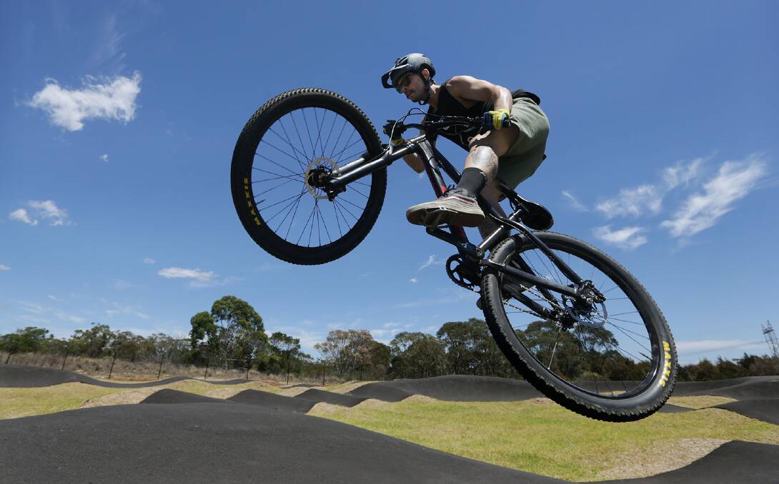 Cyclist Blake Nielsen tries out a pump track at Barden Ridge in Southern Sydney when it opened in 2018. Photo: John Veage