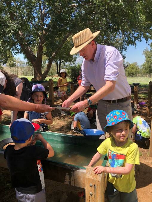 Andrew Gee MP watched the children gold panning for a while and then decided to have a go himself. Photo: Joy Harrison