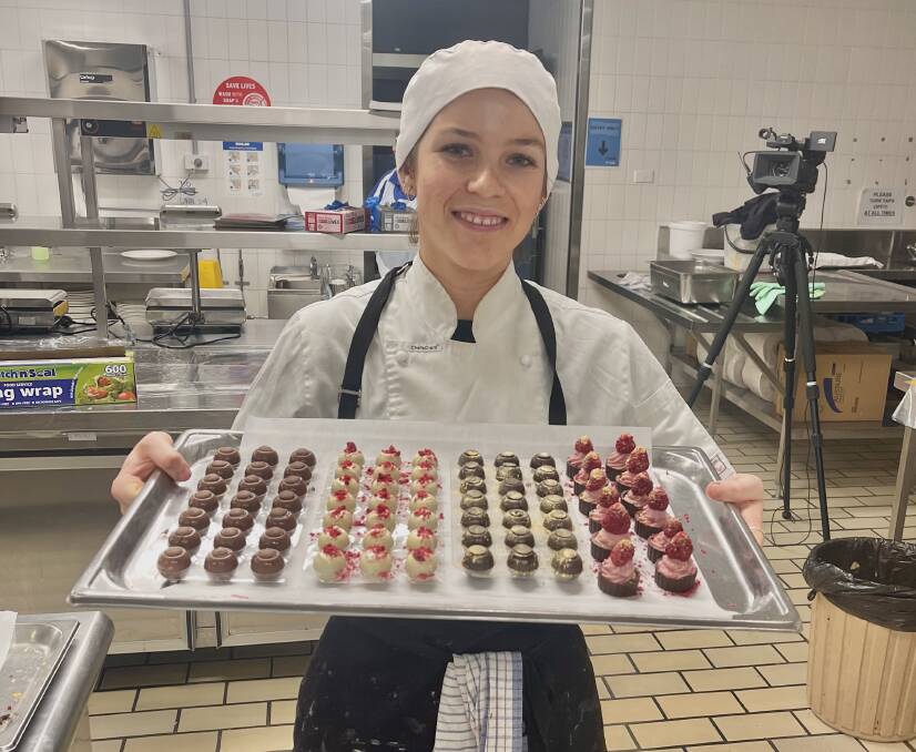 Lucy Tanner-Norman in the kitchen with an impressive tray of chocolates. Photo: Supplied