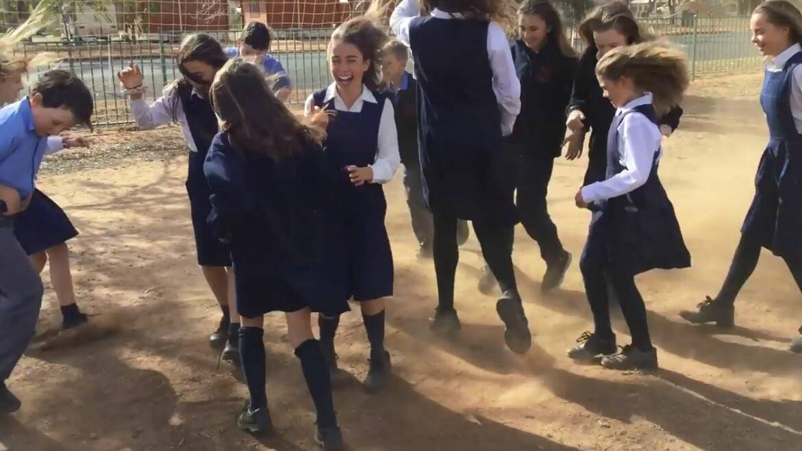 LET'S RAIN DANCE: Year 5/6 students at St John's Parish School in Trangie are behind the upcoming simultaneous rain dance. Photo: SUPPLIED
