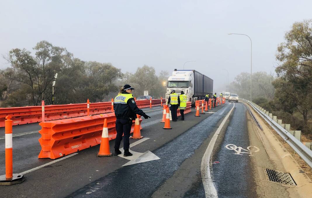 CHECK TIME: Police officers from across Western NSW have been deployed to the Victorian-NSW border. Photo: NSW POLICE